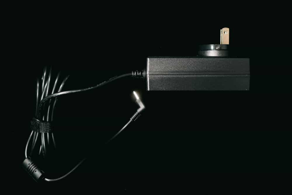 Close up of the power cable on black backdrop