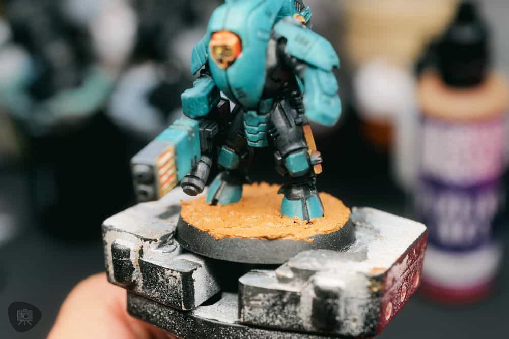 How to Paint Plastic Miniatures (Step-by-Step) - texture mud applied with the earth colored tone 