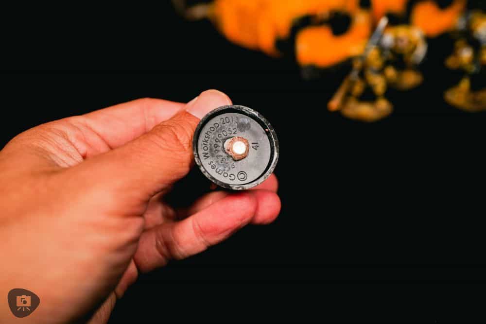 Close-up of a magnet glued to the bottom of a miniature base for magnetic transport