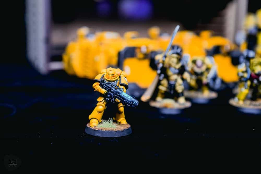 Best Budget Magnetic Miniature Carrying Case - close-up macro of a primaris space marine from warhammer 40k with blurred bokeh backdrop