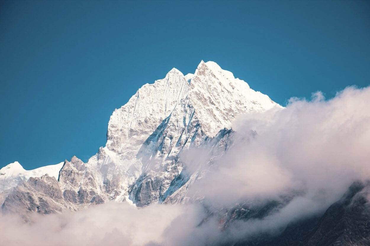 snow covered mountain under blue sky - mount everest 