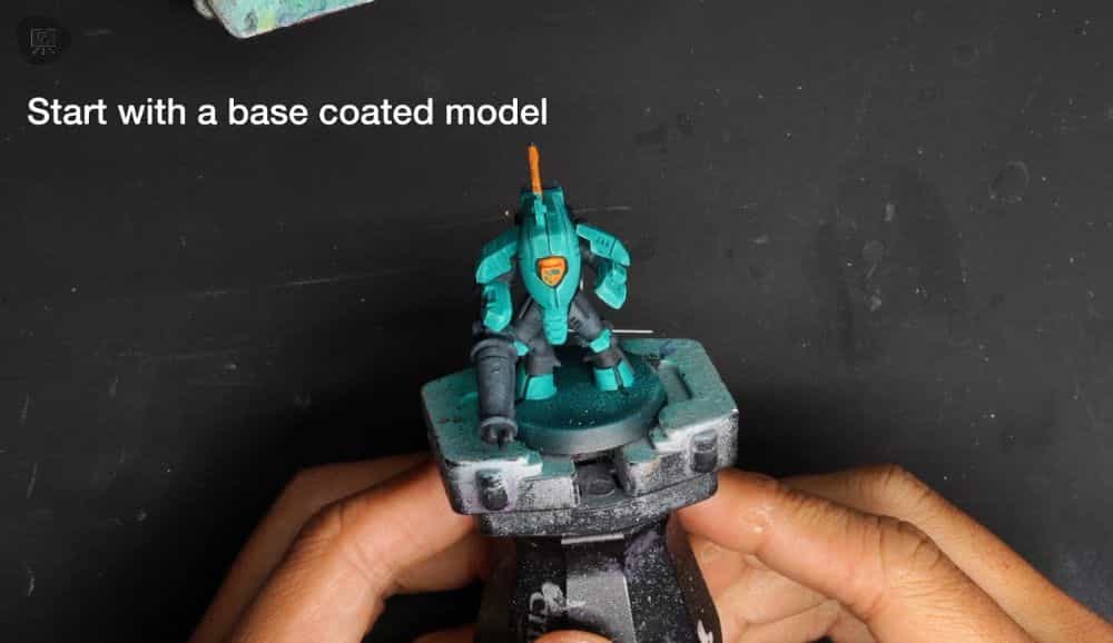 How to Shade Panel Lines and Recesses with Watercolor (Fast and Simple) - basecoated teal painted miniature prepped for watercolors