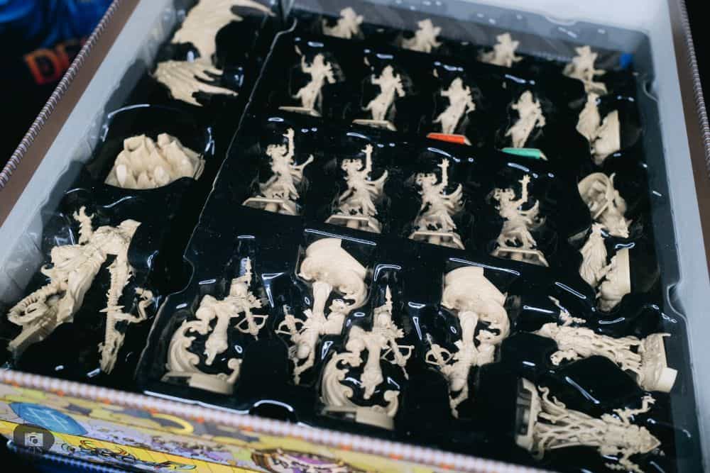 Plastic board game miniatures in the box