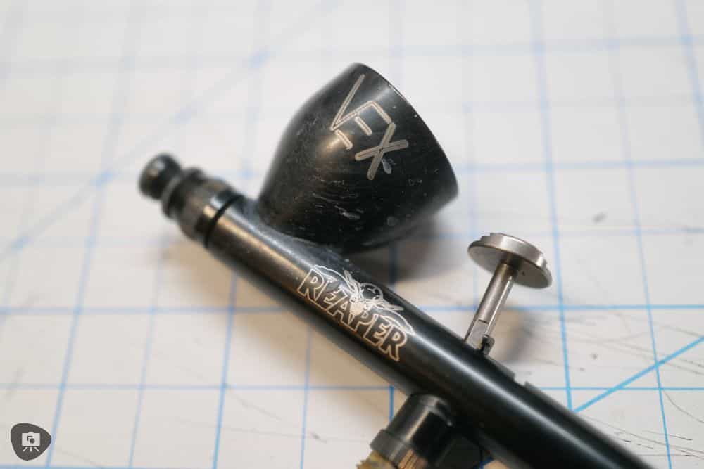 Vex reaper airbrush close up on logo