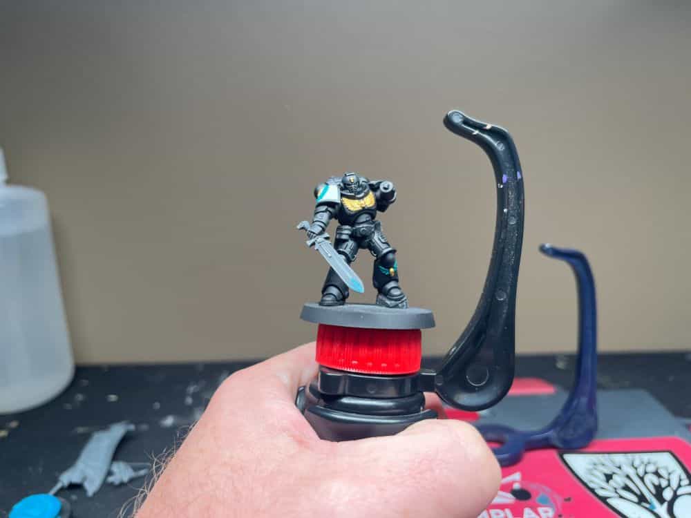 Work in progress using the game envy hobby holder with black templar space marine miniature attached