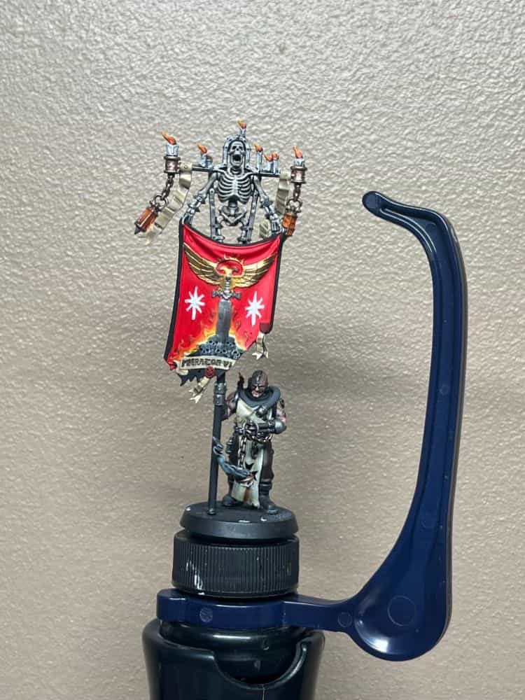 space marine with banner painting with the hobby holder