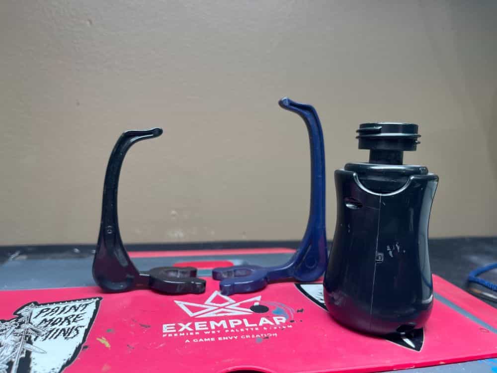 Game envy hobby holder with stability arms on tabletop
