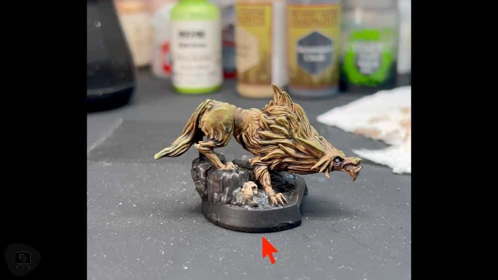 Speed Painting Board Game Miniatures: A Step-by-Step Guide - Red arrow showing details on miniature's base skull close