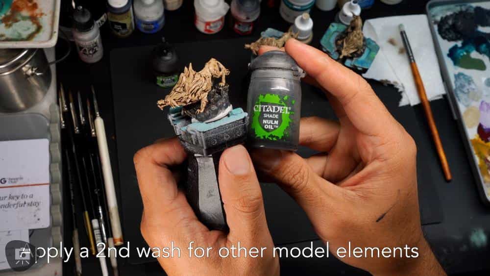 Speed Painting Board Game Miniatures: A Step-by-Step Guide - Nuln oil wash pot next to a miniature from descent board game