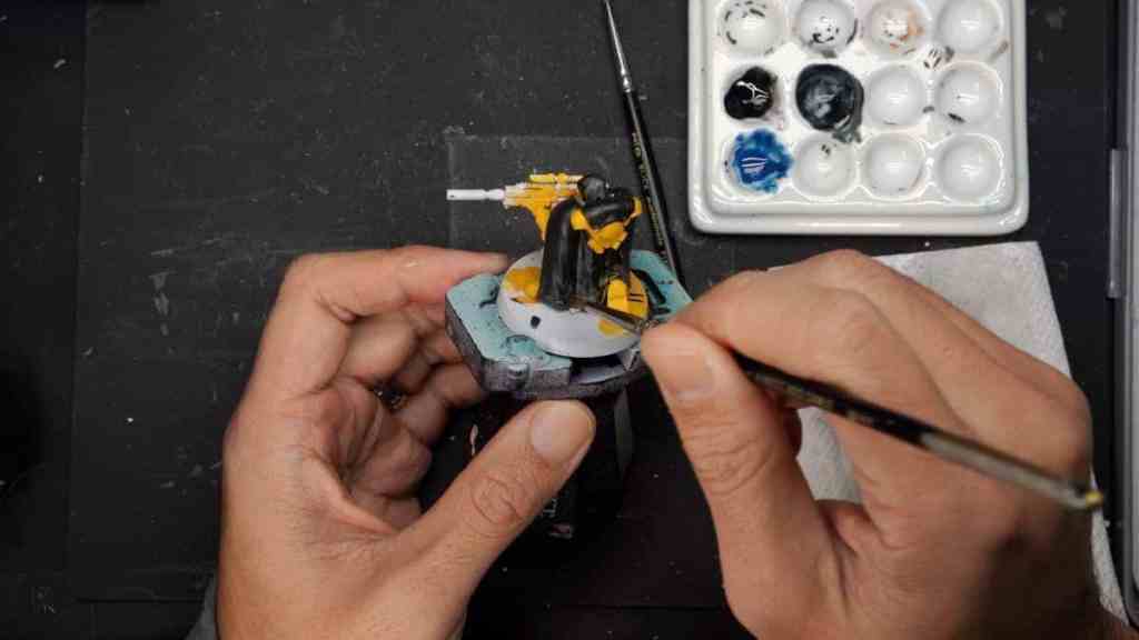 How to paint black on miniatures - tips steps - layers of off black base coat on miniature cloth