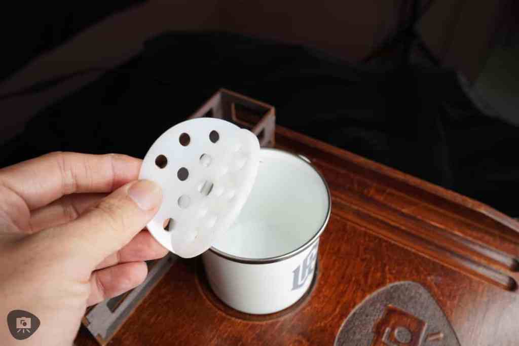Frontier Wargaming The Hobby Deck Review - Plastic brush rinser insert in my hand above the metal water rinser mug