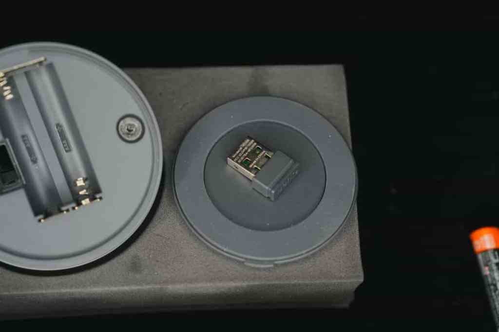 Remote control and USB dongle of BenQ IdeaCam on foam