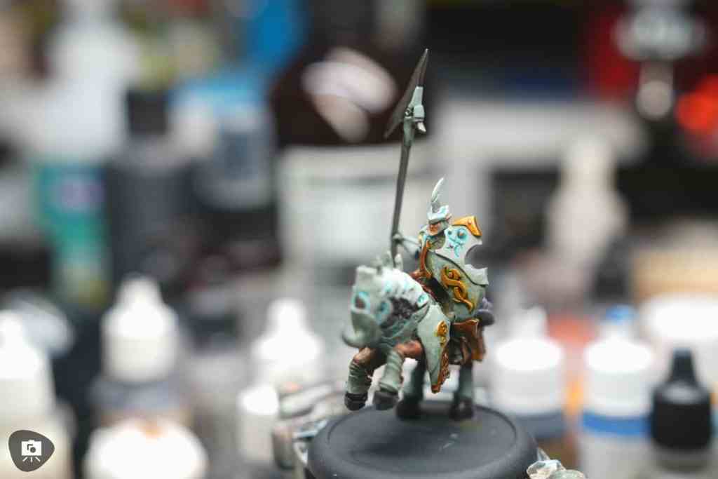 Studio photograph of a miniature on black background