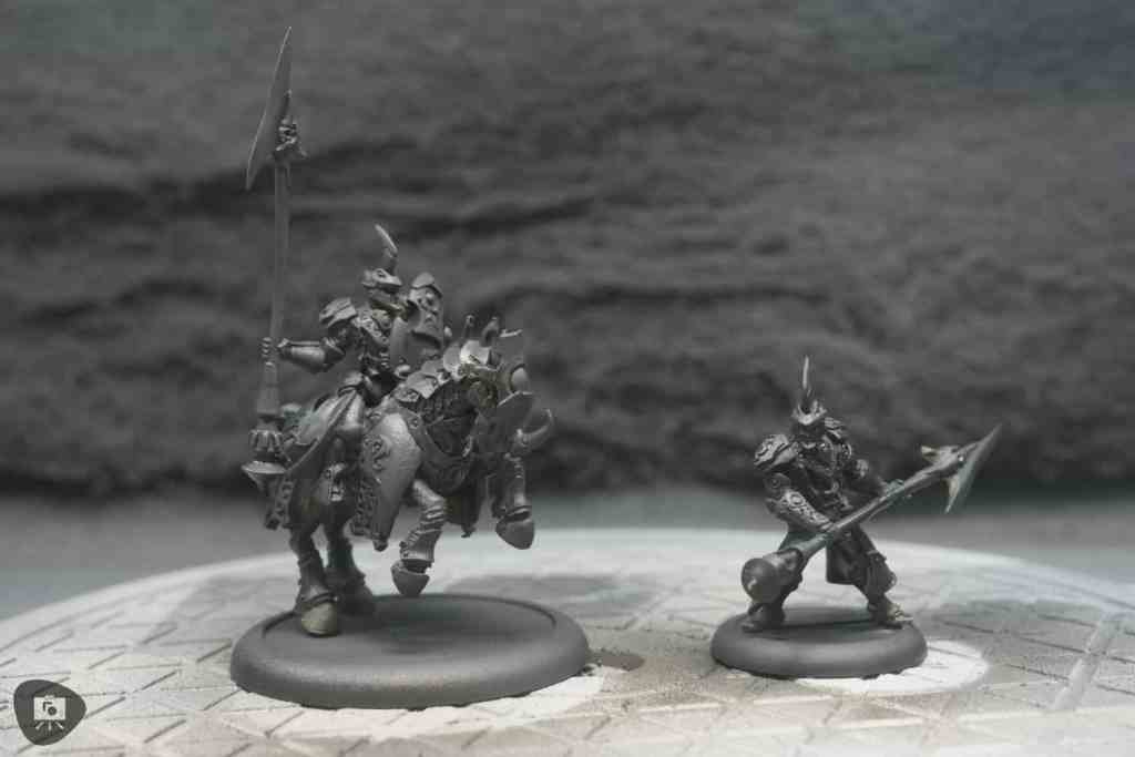 Close up primed miniatures with Vallejo Surface Primer, Panzer Grey in the spray booth