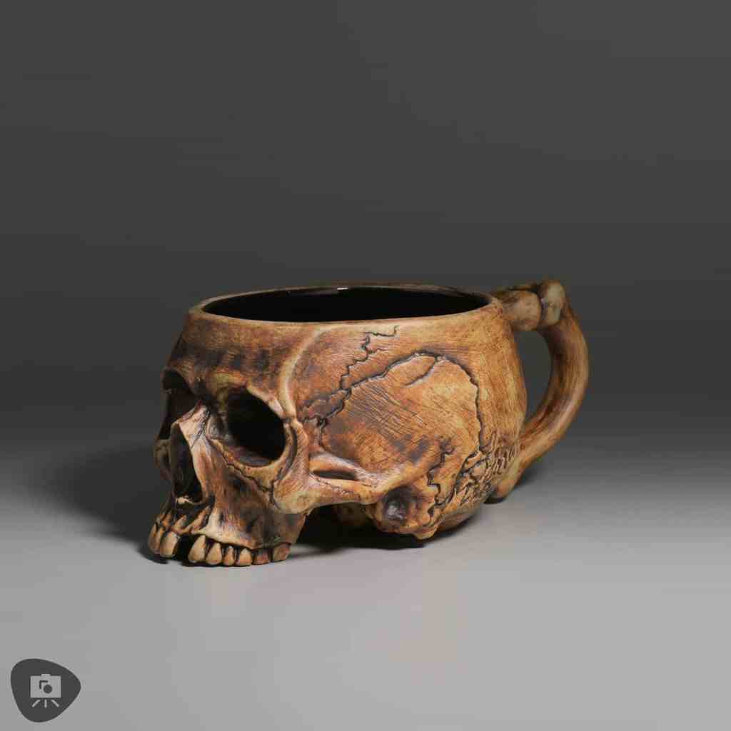 Brown skull-shaped mug with detailed cracks and textures