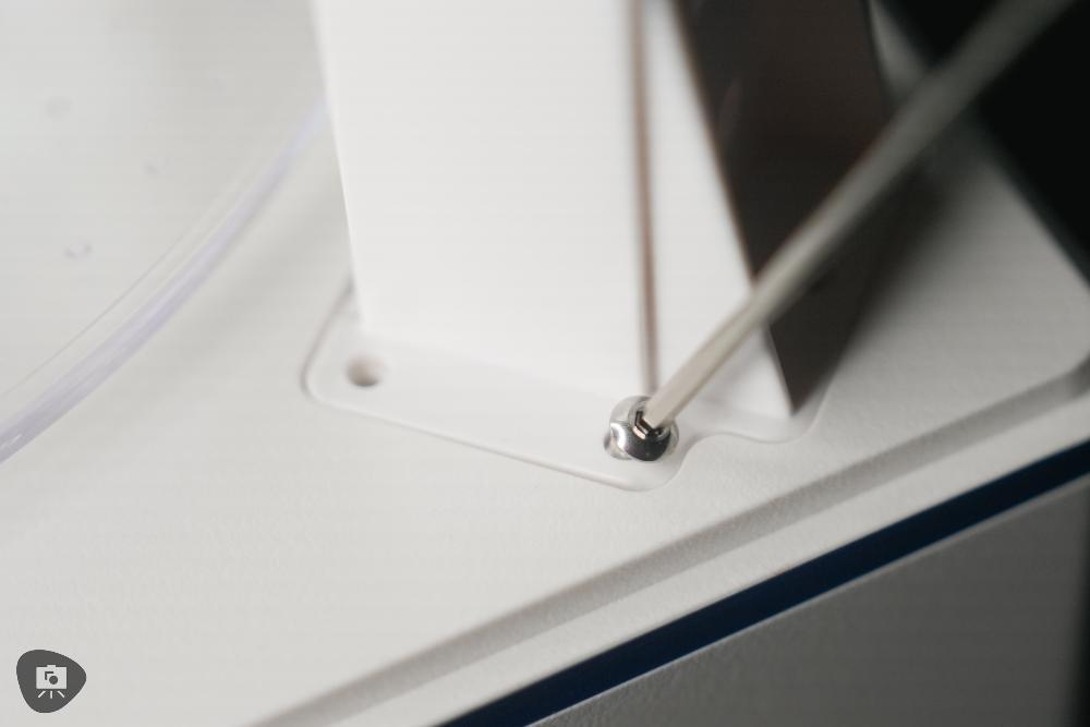 Screw being tightened with a hex tool during the assembly of the Elegoo curing station
