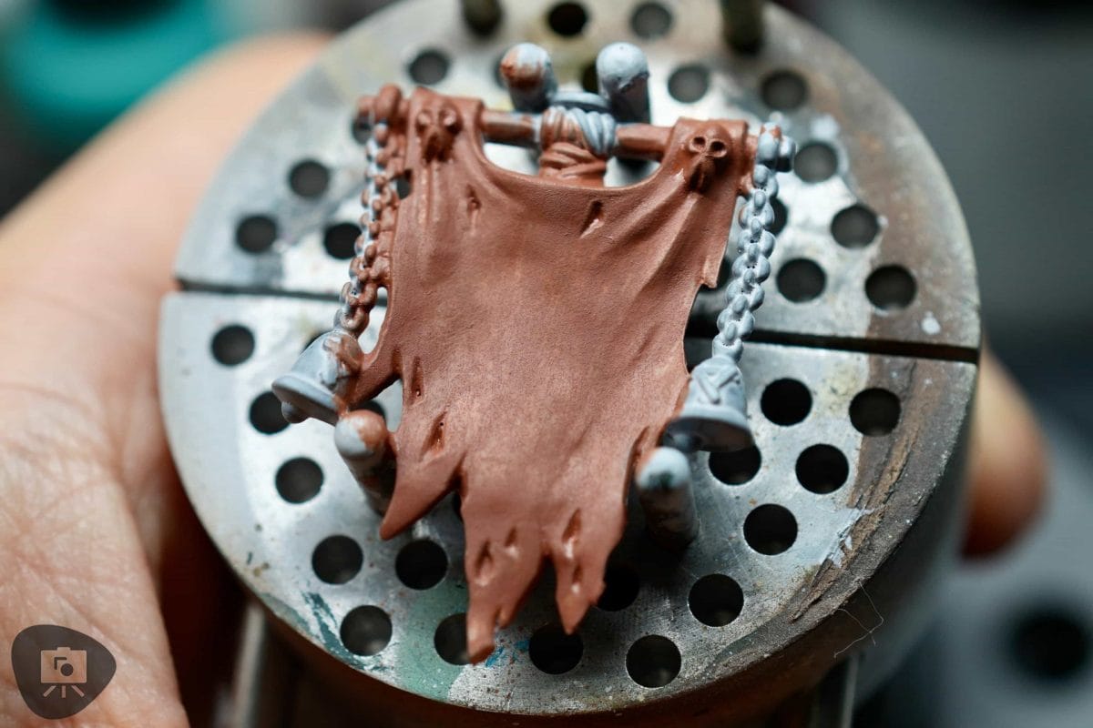 Finished miniature with a smooth, even acrylic basecoat and no visible pooling