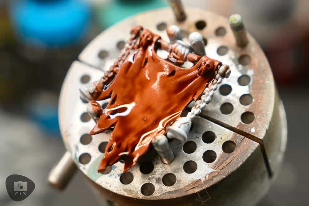 Shade wash pooling naturally in miniature recesses to create shadow contrast.